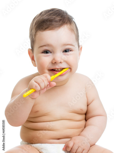 Photo: baby cleaning teeth and smiling, isolated on white background baby cleaning teeth and smiling, isolated on white background