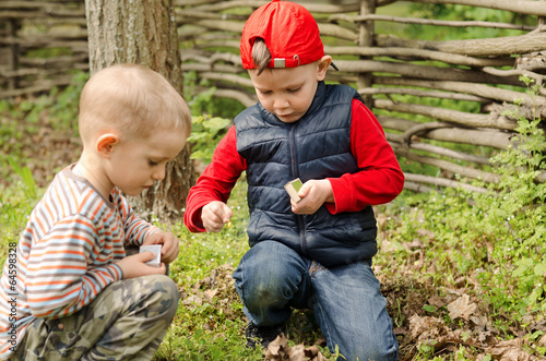 Photo: Two young boys playing with matches Two young boys playing with matches