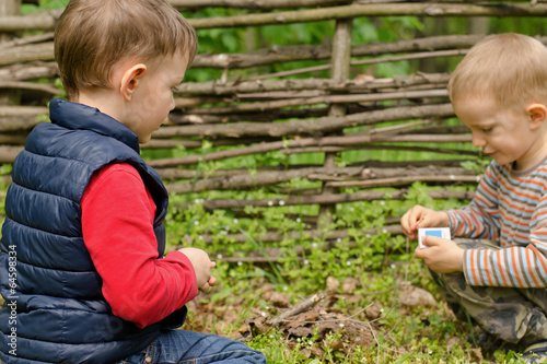 Photo: Two young boys playing with matches Two young boys playing with matches