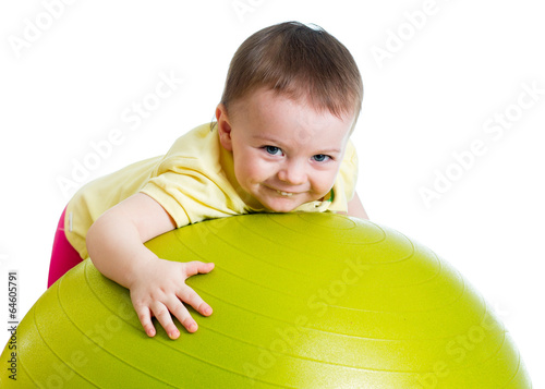 Photo: Child girl with gymnastic ball isolated Child girl with gymnastic ball isolated