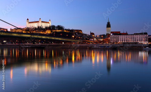 Photo: Bratislava castle and novy bridge at sunset with reflection Bratislava castle and novy bridge at sunset with reflection