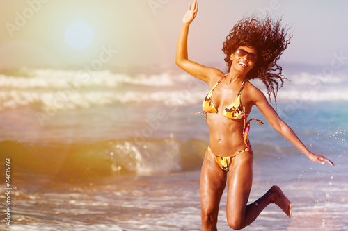 Photo: Woman on beach in summer vacation Woman on beach in summer vacation