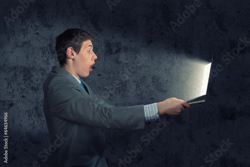 Photo: businessman with a laptop businessman with a laptop