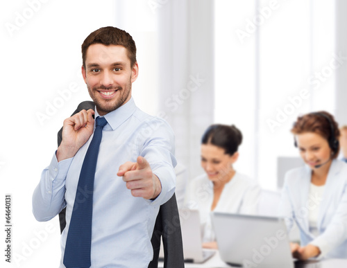 Photo: handsome buisnessman with jacket over shoulder handsome buisnessman with jacket over shoulder