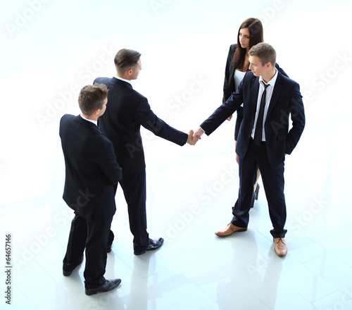 Photo: Top view of businessman shaking hands Top view of businessman shaking hands