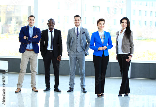 Photo: Happy smiling multi ethnic business team in office Happy smiling multi ethnic business team in office