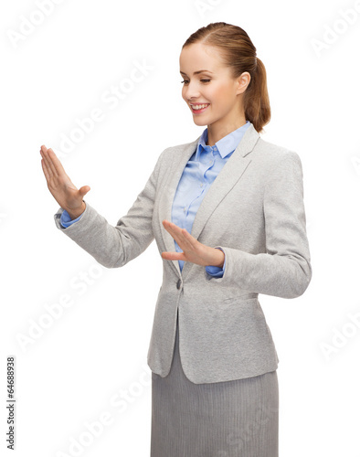 Photo: smiling businesswoman pointing to something smiling businesswoman pointing to something