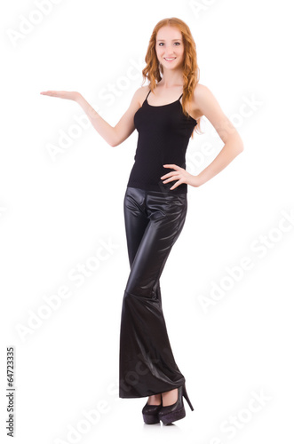 Photo: Redhead woman in black bell bottom pants on white Redhead woman in black bell bottom pants on white