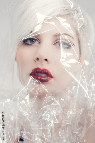 Photo: Blonde woman model wrapped in plastic Blonde woman model wrapped in plastic
