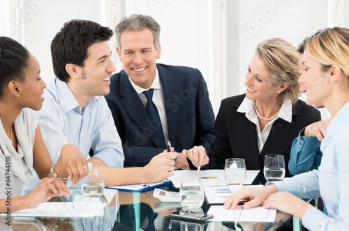 Photo: Businesspeople Discussing In Meeting Businesspeople Discussing In Meeting