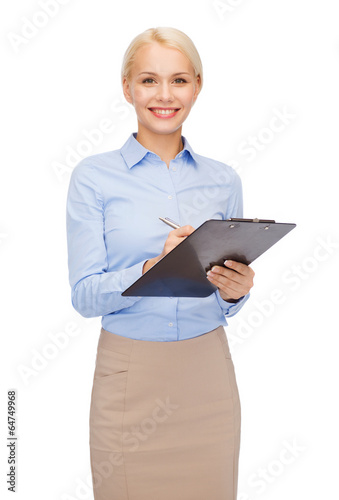 Photo: smiling businesswoman with clipboard and pen smiling businesswoman with clipboard and pen