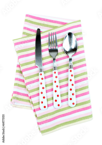 Photo: Kitchen cutlery on color napkin isolated on white Kitchen cutlery on color napkin isolated on white