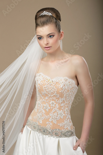 Photo: Sophisticated Woman in Festive Modern Dress and Diadem Sophisticated Woman in Festive Modern Dress and Diadem