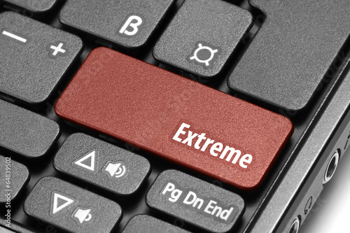 Photo: Extreme. Red hot key on computer keyboard Extreme. Red hot key on computer keyboard