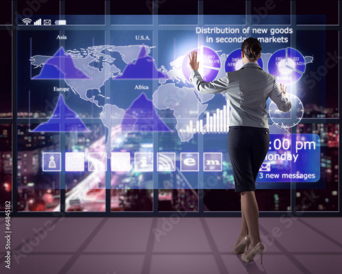 Photo: businesswoman working with virtual technologies businesswoman working with virtual technologies