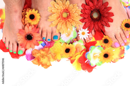 Photo: women feets and flowers (pedicure tbackground) women feets and flowers (pedicure tbackground)