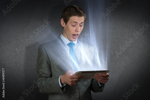 Photo: businessman with a tablet computer businessman with a tablet computer