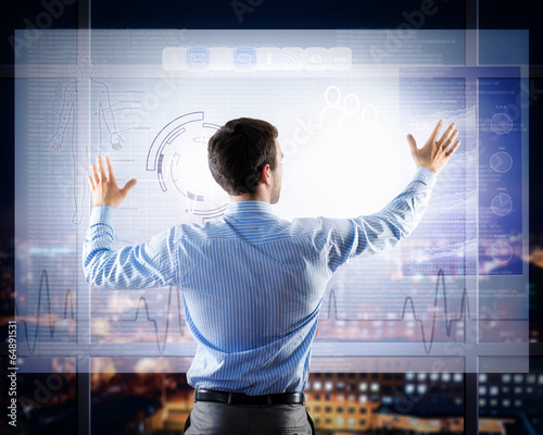 Photo: businessman working with virtual technologies businessman working with virtual technologies