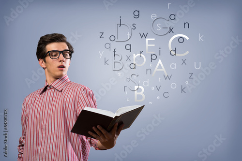 Photo: young man scientist with book young man scientist with book