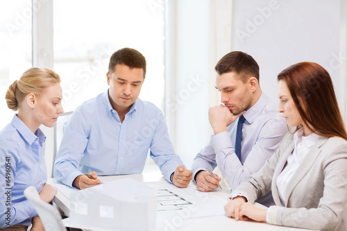 Photo: team of architects and designers in office team of architects and designers in office