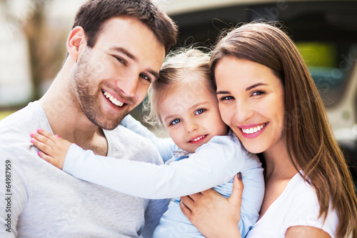 Photo: Young family embracing Young family embracing