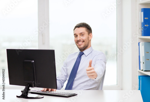Photo: smiling businessman or student with computer smiling businessman or student with computer