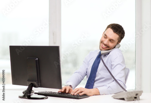 Photo: smiling businessman or student with computer smiling businessman or student with computer