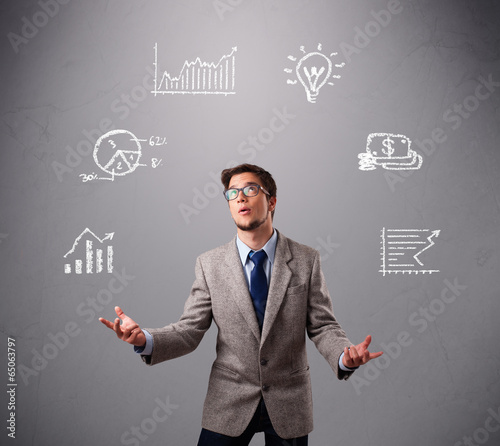 Photo: young boy juggling with statistics and graphs young boy juggling with statistics and graphs