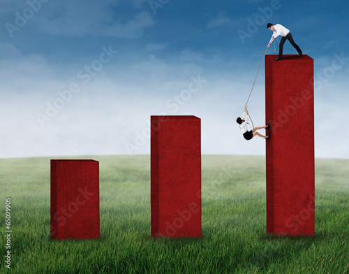 Photo: Businessman help his business partner 2 Businessman help his business partner 2