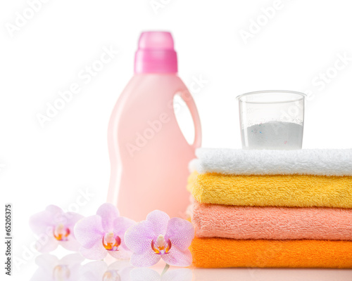 Photo: Detergent for washing machine in laundry with towels Detergent for washing machine in laundry with towels