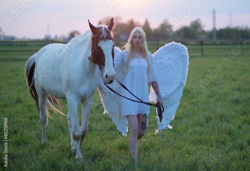Photo: Sensual angel walking with the horse Sensual angel walking with the horse