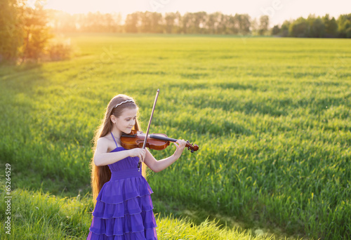 Photo: beautiful girl with violin outdoor beautiful girl with violin outdoor