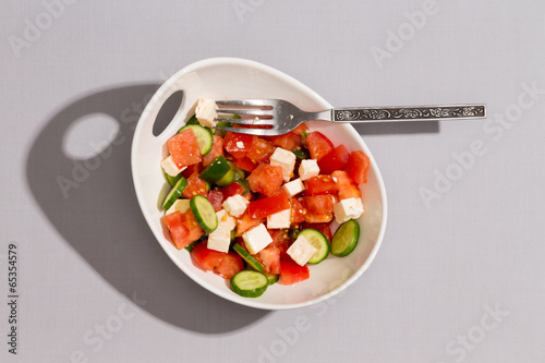 Photo: Bowl of fresh tasty Mediterranean salad Bowl of fresh tasty Mediterranean salad