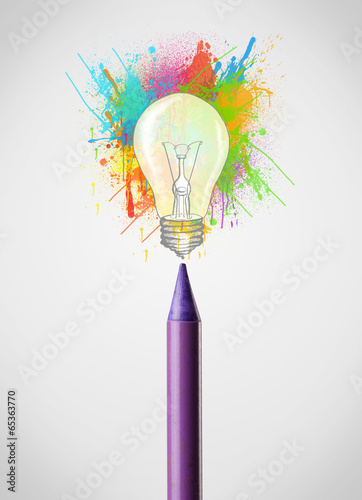 Photo: Pencil close-up with colored paint splashes and lightbulb Pencil close-up with colored paint splashes and lightbulb