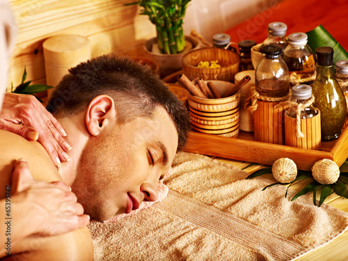 Photo: Woman getting bamboo massage. Woman getting bamboo massage.
