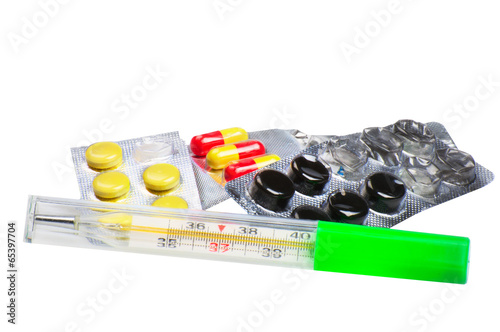 Photo: Pills and thermometer Pills and thermometer