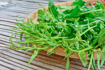 Water spinach on bamboo basket