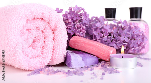 Photo: Composition with spa treatment, towels and lilac flowers, Composition with spa treatment, towels and lilac flowers,