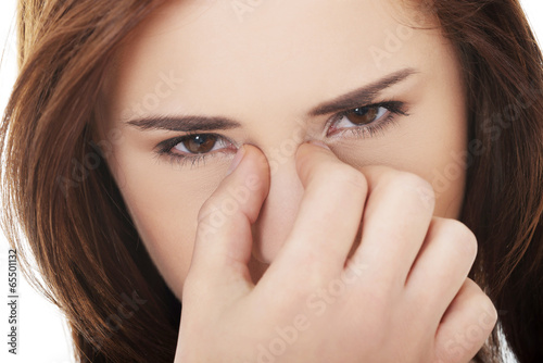 Photo: Woman with sinus pressure pain Woman with sinus pressure pain