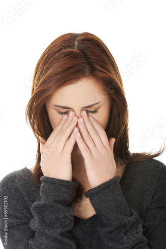 Photo: Woman with sinus pressure pain Woman with sinus pressure pain