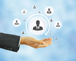 Hand holding businessman icon - HR concept Hand holding businessman icon - HR concept
