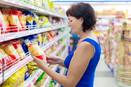 Photo: woman buys pasta woman buys pasta