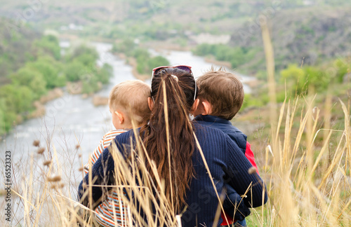 Photo: Mother with two boys enjoying a day in nature Mother with two boys enjoying a day in nature