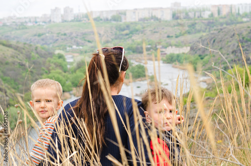 Photo: Mother with two boys enjoying a day in nature Mother with two boys enjoying a day in nature