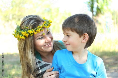 Photo: Happy mom and son in the park Happy mom and son in the park