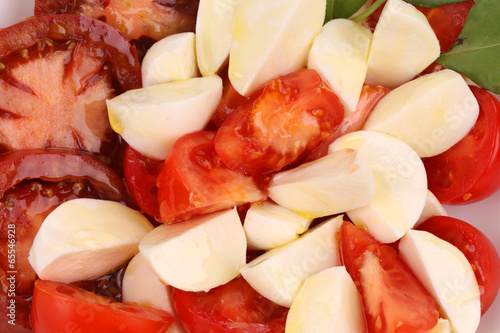 Photo: Close up of caprese salad. Macro. Close up of caprese salad. Macro.