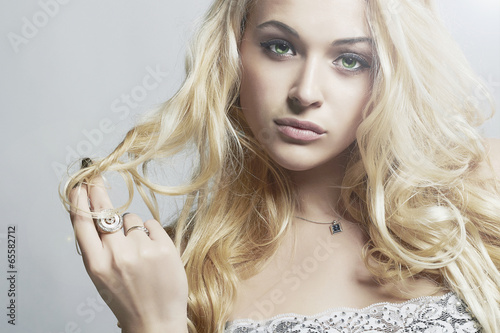 Photo: fashion portrait of Beautiful woman.Blond Girl with Curly hair fashion portrait of Beautiful woman.Blond Girl with Curly hair