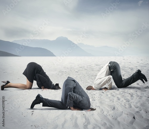 Photo: Fear of crisis with businessman like an ostrich Fear of crisis with businessman like an ostrich