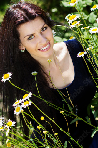 Photo: Portrait of young beautiful woman outdoors Portrait of young beautiful woman outdoors