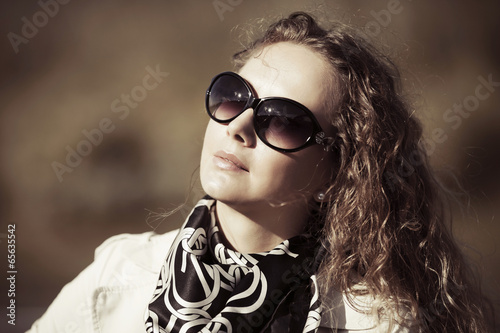 Photo: Fashion woman with long curly hairs Fashion woman with long curly hairs